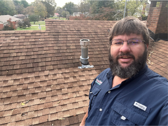 Leslie Forrester on a customer's roof