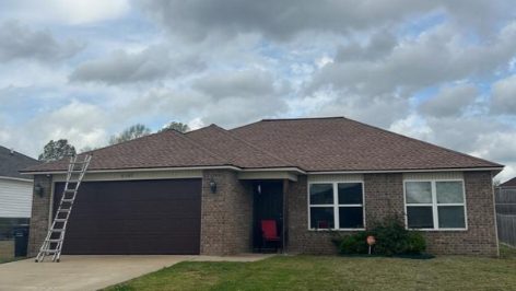 Brick home with a finished new shingle roof